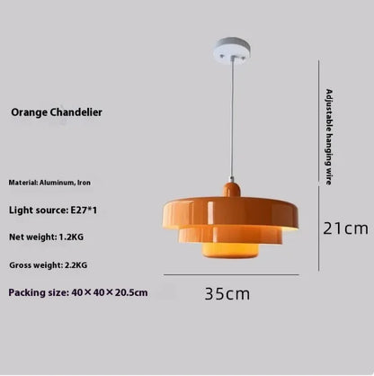 Orange chandelier with dimensions and material details on a gray background